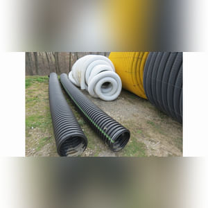 Roll of 4â? & 6â? perforated tile & misc. sticks of tile