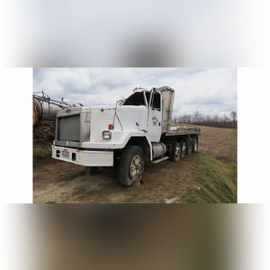 Volvo GM HD truck, tandem-axle w/ 2 cheaters, 24â?? Eby alum. flatbed & side racks, (Wrecked, for parts)