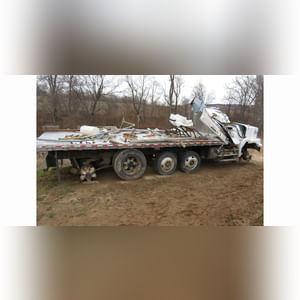 Volvo GM HD truck, tandem-axle w/ 2 cheaters, 24â?? Eby alum. flatbed & side racks, (Wrecked, for parts)