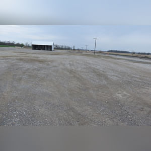 This building is a 26â??x50â??, 3-sided pole shed with 11.5â?? eves and gravel floor.