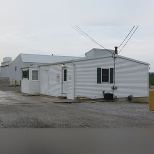This office building with nearly 1,100 sq. ft. and a full, poured-wall basement, has a natural gas air-forced furnace and central air.  This building offers a very nice floor plan which includes 10â??x10â??, 15â??x8â??, and 12â??x7â?? offices, a 12â??x6â?? file room, a large lobby area, and a restroom.  In addition, the 9.5â??x60â?? in-ground truck scale with a 120,000 lb. capacity is located immediately in front of this building complete with a UMC 465 digital scale display.