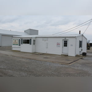 This office building with nearly 1,100 sq. ft. and a full, poured-wall basement, has a natural gas air-forced furnace and central air.  This building offers a very nice floor plan which includes 10â??x10â??, 15â??x8â??, and 12â??x7â?? offices, a 12â??x6â?? file room, a large lobby area, and a restroom.  In addition, the 9.5â??x60â?? in-ground truck scale with a 120,000 lb. capacity is located immediately in front of this building complete with a UMC 465 digital scale display.