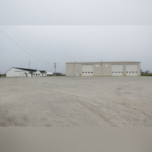 Great location just off of US-33.  Large, stone lot with easy access off of Bay Road.  50â??x50â?? concrete-walled containment area.  Lots of outdoor security lighting.  4â? well and private septic system