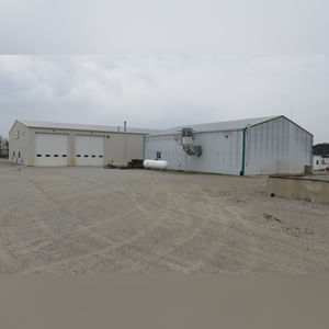 This steel-framed, completely insulated building boasts many custom features making it ideal for multiple purposes.  It includes (3) office areas with built-in work surfaces, air conditioning, and LP gas forced-air heat. (2 offices are 12â??x11â?? & the other is 19â??x11â??.)  The garage/shop area is 75â??x100â?? with concrete floors & approaches, (6) 16â??x16â?? overhead doors with openers, (4) walk-in doors, and loft storage area above offices.  Additional amenities include (2) Reznor LP heaters, Energylogic waste oil furnace, ventilation system with louvered panels, ceiling fans, multiple electrical panels with 220 amp service, several outdoor electrical outlets with pigtail cords to plug in tractors, semis, etc., and a 10 HP 2-stage NAPA air compressor.