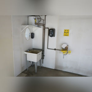 This steel-framed, completely insulated building boasts many custom features making it ideal for multiple purposes.  It includes (3) office areas with built-in work surfaces, air conditioning, and LP gas forced-air heat. (2 offices are 12â??x11â?? & the other is 19â??x11â??.)  The garage/shop area is 75â??x100â?? with concrete floors & approaches, (6) 16â??x16â?? overhead doors with openers, (4) walk-in doors, and loft storage area above offices.  Additional amenities include (2) Reznor LP heaters, Energylogic waste oil furnace, ventilation system with louvered panels, ceiling fans, multiple electrical panels with 220 amp service, several outdoor electrical outlets with pigtail cords to plug in tractors, semis, etc., and a 10 HP 2-stage NAPA air compressor.