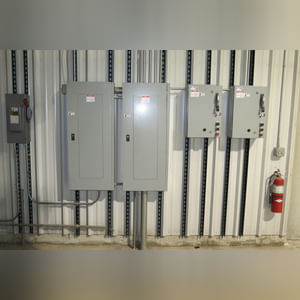 This steel-framed, completely insulated building boasts many custom features making it ideal for multiple purposes.  It includes (3) office areas with built-in work surfaces, air conditioning, and LP gas forced-air heat. (2 offices are 12â??x11â?? & the other is 19â??x11â??.)  The garage/shop area is 75â??x100â?? with concrete floors & approaches, (6) 16â??x16â?? overhead doors with openers, (4) walk-in doors, and loft storage area above offices.  Additional amenities include (2) Reznor LP heaters, Energylogic waste oil furnace, ventilation system with louvered panels, ceiling fans, multiple electrical panels with 220 amp service, several outdoor electrical outlets with pigtail cords to plug in tractors, semis, etc., and a 10 HP 2-stage NAPA air compressor.