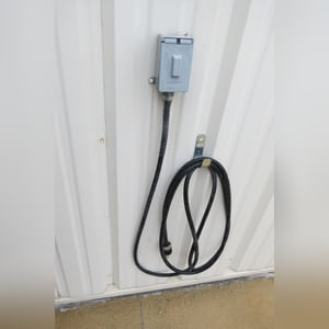 This steel-framed, completely insulated building boasts many custom features making it ideal for multiple purposes.  It includes (3) office areas with built-in work surfaces, air conditioning, and LP gas forced-air heat. (2 offices are 12â??x11â?? & the other is 19â??x11â??.)  The garage/shop area is 75â??x100â?? with concrete floors & approaches, (6) 16â??x16â?? overhead doors with openers, (4) walk-in doors, and loft storage area above offices.  Additional amenities include (2) Reznor LP heaters, Energylogic waste oil furnace, ventilation system with louvered panels, ceiling fans, multiple electrical panels with 220 amp service, several outdoor electrical outlets with pigtail cords to plug in tractors, semis, etc., and a 10 HP 2-stage NAPA air compressor.