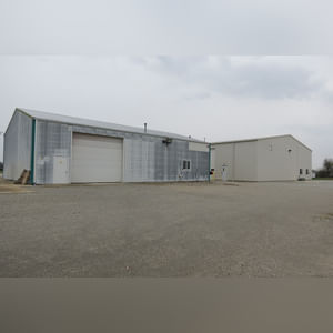 This 45â??x60â?? garage/shop has a concrete floor and approaches, (2) overhead doors with openers (14.5â??x13â?? and 15â??x13â??), (2) walk-in doors, and restroom.  The building also includes (2) Vantage LP overhead radiant heaters, (2) Modine high-efficiency LP heaters, an exceptional ventilation system, and 220 amp service.