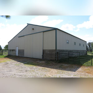 10± acres, home, pole barn, shop building, fenced pastures, and pond. The impressive interior of the home boasts 4 bedrooms and 3 full baths. The master suite is 16â??x16â?? with a large walk-in closet. The master bath has a double sink and a large custom shower. The 22â??x14â?? eat-in kitchen has custom cabinets, granite counter tops, and a brick-front raised fireplace. The large main level also includes the 20â??x14â?? living room with fireplace, 18â??x16â?? family room, 14â??x12â?? office area, mud room, and laundry room. This spacious main level floor plan is ideal for the family as well as entertaining. The full basement is partially finished, and the 2-car attached garage includes a large storage area. Other amenities within the home include a Lennox LP gas forced-air furnace, central air, Pella windows, a newer roof, cathedral ceilings, ceramic tile and wood flooring, ceiling fans, and a Radionon system. The exterior is beautifully landscaped with mature trees, colorful perennials, a small orchard and grape vineyard, a large play area, and a ½ acre stocked pond. The 60â??x50â?? pole barn with walk-in door and 14â??-high end slider includes grooved concrete, maternity pens, custom Gingway gates, a working chute, and 4 individual turn-out pens. There are 6 fenced and cross-fenced pasture areas, each with its own Ritchie waterer. The 34â??x32â?? shop building has a concrete floor, porch, and walk-in and overhead doors.