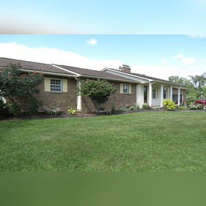 10± acres, home, pole barn, shop building, fenced pastures, and pond. The impressive interior of the home boasts 4 bedrooms and 3 full baths. The master suite is 16â??x16â?? with a large walk-in closet. The master bath has a double sink and a large custom shower. The 22â??x14â?? eat-in kitchen has custom cabinets, granite counter tops, and a brick-front raised fireplace. The large main level also includes the 20â??x14â?? living room with fireplace, 18â??x16â?? family room, 14â??x12â?? office area, mud room, and laundry room. This spacious main level floor plan is ideal for the family as well as entertaining. The full basement is partially finished, and the 2-car attached garage includes a large storage area. Other amenities within the home include a Lennox LP gas forced-air furnace, central air, Pella windows, a newer roof, cathedral ceilings, ceramic tile and wood flooring, ceiling fans, and a Radionon system. The exterior is beautifully landscaped with mature trees, colorful perennials, a small orchard and grape vineyard, a large play area, and a ½ acre stocked pond. The 60â??x50â?? pole barn with walk-in door and 14â??-high end slider includes grooved concrete, maternity pens, custom Gingway gates, a working chute, and 4 individual turn-out pens. There are 6 fenced and cross-fenced pasture areas, each with its own Ritchie waterer. The 34â??x32â?? shop building has a concrete floor, porch, and walk-in and overhead doors.