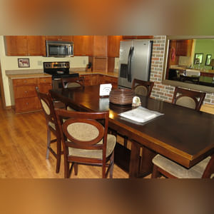 10± acres, home, pole barn, shop building, fenced pastures, and pond. The impressive interior of the home boasts 4 bedrooms and 3 full baths. The master suite is 16â??x16â?? with a large walk-in closet. The master bath has a double sink and a large custom shower. The 22â??x14â?? eat-in kitchen has custom cabinets, granite counter tops, and a brick-front raised fireplace. The large main level also includes the 20â??x14â?? living room with fireplace, 18â??x16â?? family room, 14â??x12â?? office area, mud room, and laundry room. This spacious main level floor plan is ideal for the family as well as entertaining. The full basement is partially finished, and the 2-car attached garage includes a large storage area. Other amenities within the home include a Lennox LP gas forced-air furnace, central air, Pella windows, a newer roof, cathedral ceilings, ceramic tile and wood flooring, ceiling fans, and a Radionon system. The exterior is beautifully landscaped with mature trees, colorful perennials, a small orchard and grape vineyard, a large play area, and a ½ acre stocked pond. The 60â??x50â?? pole barn with walk-in door and 14â??-high end slider includes grooved concrete, maternity pens, custom Gingway gates, a working chute, and 4 individual turn-out pens. There are 6 fenced and cross-fenced pasture areas, each with its own Ritchie waterer. The 34â??x32â?? shop building has a concrete floor, porch, and walk-in and overhead doors.