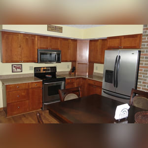 10± acres, home, pole barn, shop building, fenced pastures, and pond. The impressive interior of the home boasts 4 bedrooms and 3 full baths. The master suite is 16â??x16â?? with a large walk-in closet. The master bath has a double sink and a large custom shower. The 22â??x14â?? eat-in kitchen has custom cabinets, granite counter tops, and a brick-front raised fireplace. The large main level also includes the 20â??x14â?? living room with fireplace, 18â??x16â?? family room, 14â??x12â?? office area, mud room, and laundry room. This spacious main level floor plan is ideal for the family as well as entertaining. The full basement is partially finished, and the 2-car attached garage includes a large storage area. Other amenities within the home include a Lennox LP gas forced-air furnace, central air, Pella windows, a newer roof, cathedral ceilings, ceramic tile and wood flooring, ceiling fans, and a Radionon system. The exterior is beautifully landscaped with mature trees, colorful perennials, a small orchard and grape vineyard, a large play area, and a ½ acre stocked pond. The 60â??x50â?? pole barn with walk-in door and 14â??-high end slider includes grooved concrete, maternity pens, custom Gingway gates, a working chute, and 4 individual turn-out pens. There are 6 fenced and cross-fenced pasture areas, each with its own Ritchie waterer. The 34â??x32â?? shop building has a concrete floor, porch, and walk-in and overhead doors.