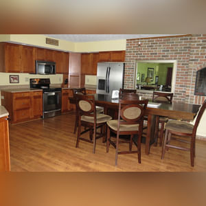 10± acres, home, pole barn, shop building, fenced pastures, and pond. The impressive interior of the home boasts 4 bedrooms and 3 full baths. The master suite is 16â??x16â?? with a large walk-in closet. The master bath has a double sink and a large custom shower. The 22â??x14â?? eat-in kitchen has custom cabinets, granite counter tops, and a brick-front raised fireplace. The large main level also includes the 20â??x14â?? living room with fireplace, 18â??x16â?? family room, 14â??x12â?? office area, mud room, and laundry room. This spacious main level floor plan is ideal for the family as well as entertaining. The full basement is partially finished, and the 2-car attached garage includes a large storage area. Other amenities within the home include a Lennox LP gas forced-air furnace, central air, Pella windows, a newer roof, cathedral ceilings, ceramic tile and wood flooring, ceiling fans, and a Radionon system. The exterior is beautifully landscaped with mature trees, colorful perennials, a small orchard and grape vineyard, a large play area, and a ½ acre stocked pond. The 60â??x50â?? pole barn with walk-in door and 14â??-high end slider includes grooved concrete, maternity pens, custom Gingway gates, a working chute, and 4 individual turn-out pens. There are 6 fenced and cross-fenced pasture areas, each with its own Ritchie waterer. The 34â??x32â?? shop building has a concrete floor, porch, and walk-in and overhead doors.