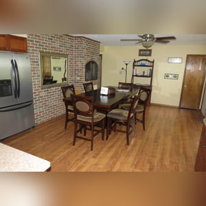 10± acres, home, pole barn, shop building, fenced pastures, and pond. The impressive interior of the home boasts 4 bedrooms and 3 full baths. The master suite is 16â??x16â?? with a large walk-in closet. The master bath has a double sink and a large custom shower. The 22â??x14â?? eat-in kitchen has custom cabinets, granite counter tops, and a brick-front raised fireplace. The large main level also includes the 20â??x14â?? living room with fireplace, 18â??x16â?? family room, 14â??x12â?? office area, mud room, and laundry room. This spacious main level floor plan is ideal for the family as well as entertaining. The full basement is partially finished, and the 2-car attached garage includes a large storage area. Other amenities within the home include a Lennox LP gas forced-air furnace, central air, Pella windows, a newer roof, cathedral ceilings, ceramic tile and wood flooring, ceiling fans, and a Radionon system. The exterior is beautifully landscaped with mature trees, colorful perennials, a small orchard and grape vineyard, a large play area, and a ½ acre stocked pond. The 60â??x50â?? pole barn with walk-in door and 14â??-high end slider includes grooved concrete, maternity pens, custom Gingway gates, a working chute, and 4 individual turn-out pens. There are 6 fenced and cross-fenced pasture areas, each with its own Ritchie waterer. The 34â??x32â?? shop building has a concrete floor, porch, and walk-in and overhead doors.